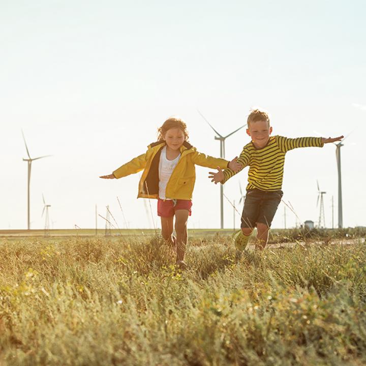 two children running in a field